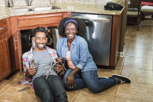 Couple fixing up kitchen